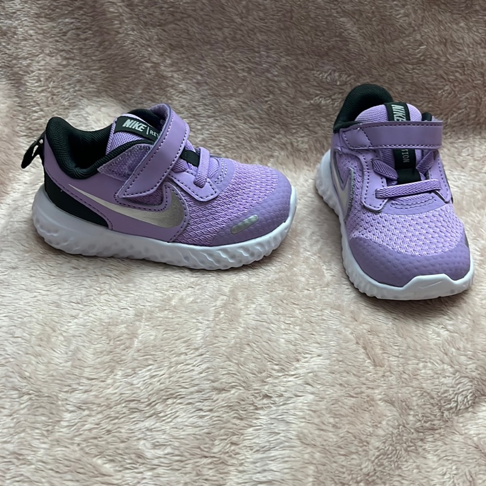 Purple Nike Revolution sneakers
